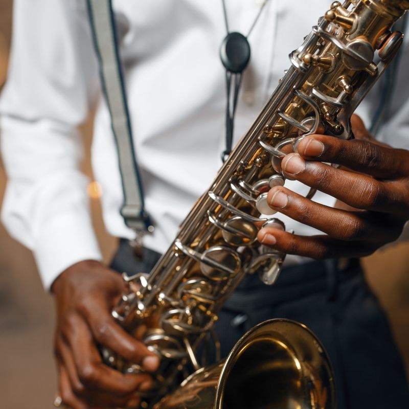 Decorative image of a saxophone player.